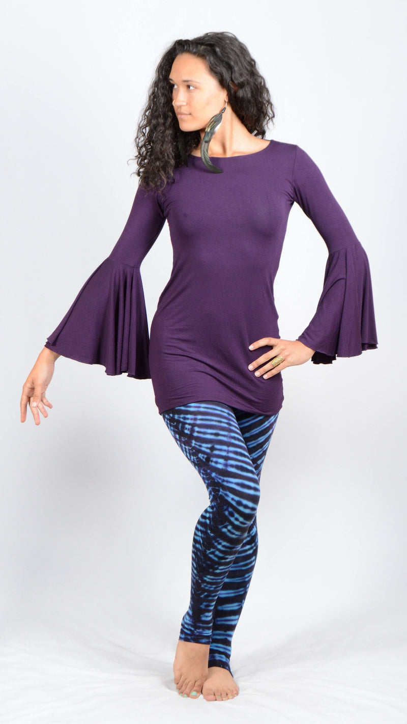 Girl wearing Umba's Bell Sleeve Tunic, Festive Long Sleeve Mini Dress, dark purple, with leggings, front view, sold at UMBA LOVE.